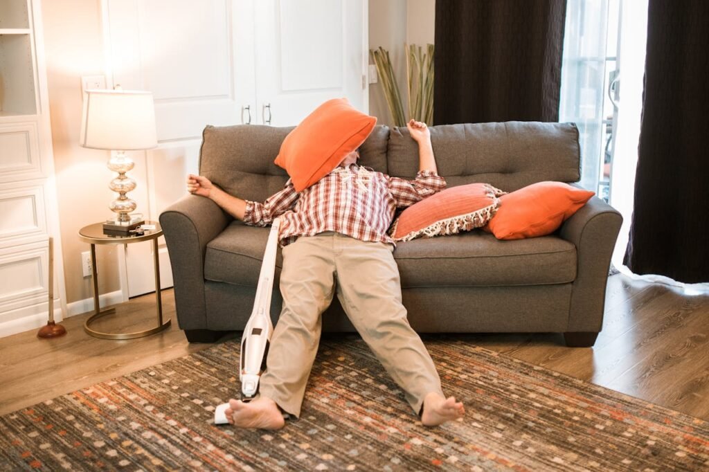 Tradie resting on the sofa, feeling tired after a long day of work.