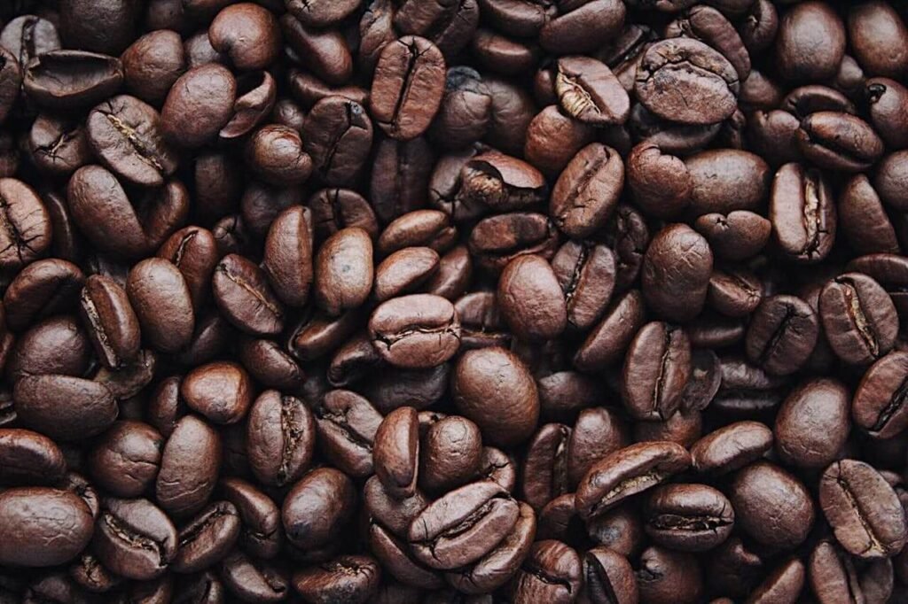 a pile of coffee beans, showing Caffeine and how much to have at work.