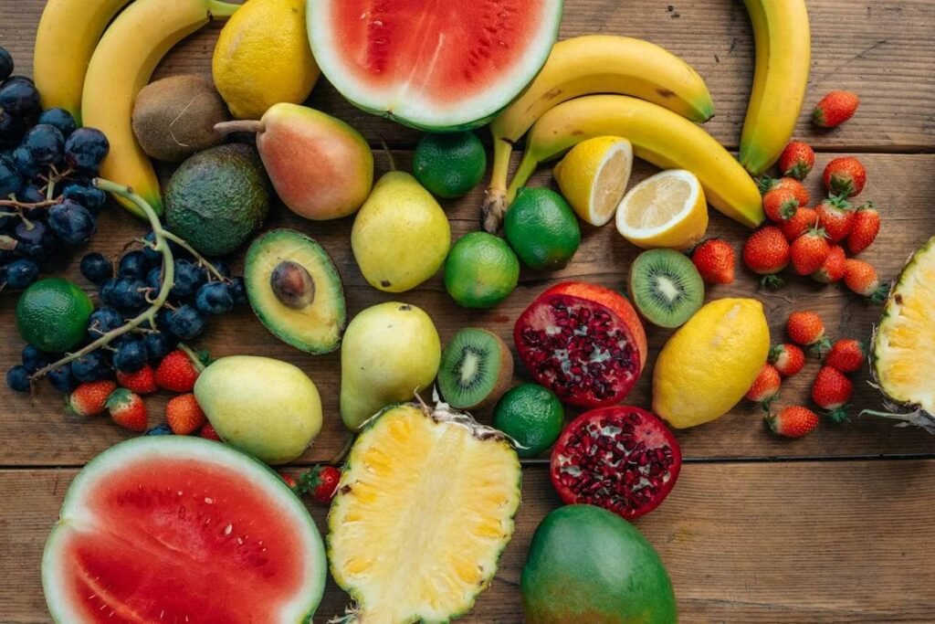 A table full of fruit showing different types of food construction workers can bring to work. Lots of healthy and nutritious fruits