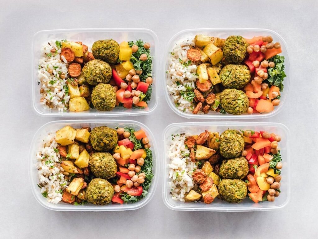 Nutrition for Construction Workers, a group of containers of food, meal prepping lunches for the week with healthy foods
