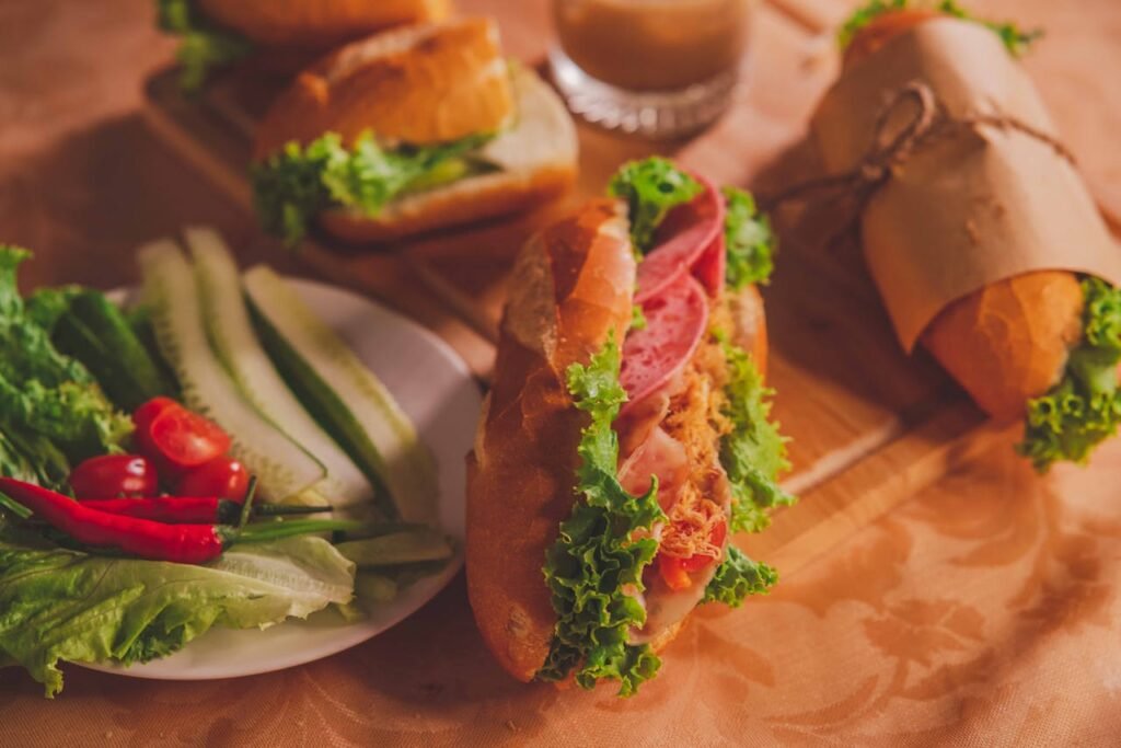 Healthy food options for tradies showing a sandwich and plate of vegetables