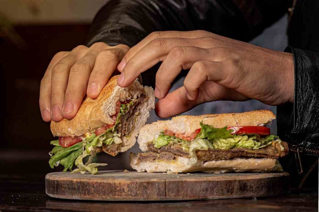 Healthy wholemeal sandwich, filled with meat and veggies, to show a good lunch idea.