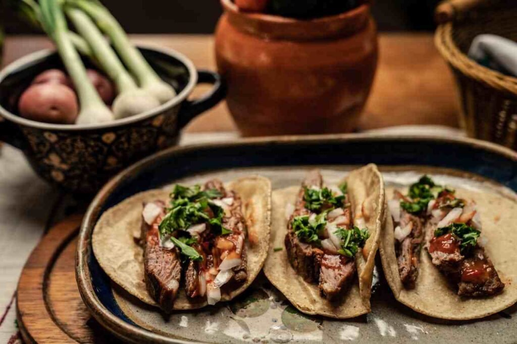 Three wraps lined up, wraps are open to show the fillings of meats and vegetables for a well-balanced high-protein lunch.