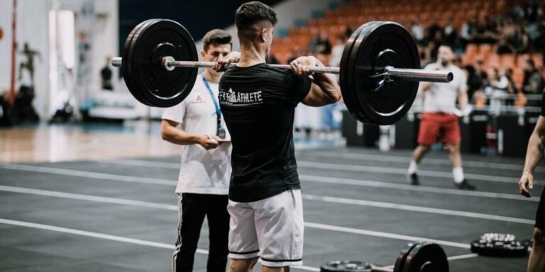 Hybrid Athlete competing in a CrossFit event, showcasing hybrid strength and endurance training.
