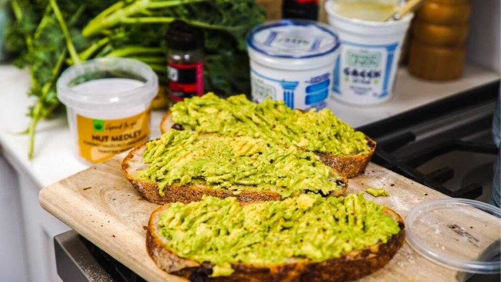 Avocado on toast with yogurt, showing healthy fats for overall nutrition and recovery