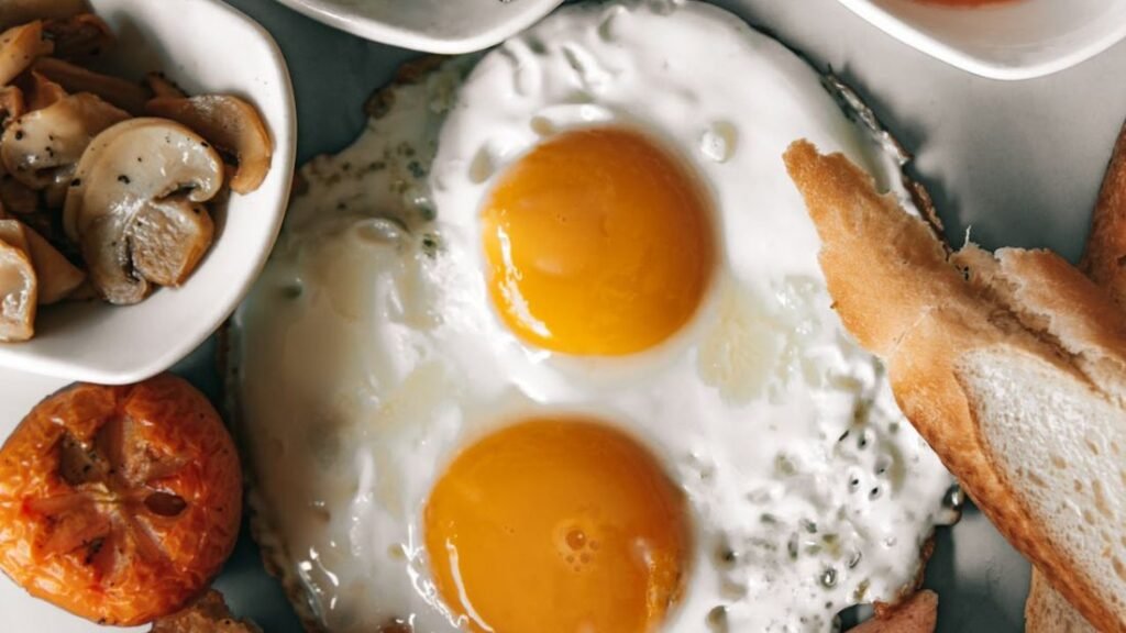 Eggs and breakfast foods showing a high-protein meal for training and recovery