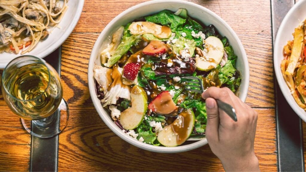 A full meal with a drink, representing total calorie intake and balanced nutrition for training