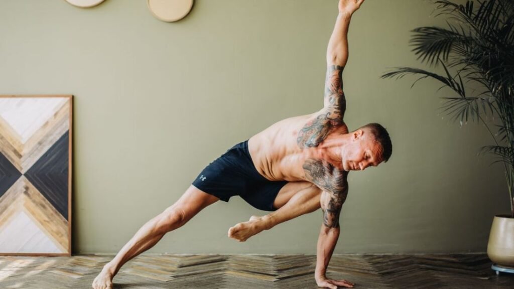 What is Mobility, being shown by a man holding a strong mobility pose on the floor.