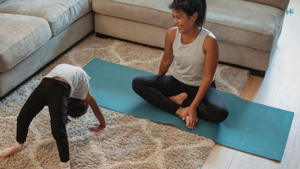 Mother and son stretching in the living room. Showing a easy Mobility and Flexibility Routine