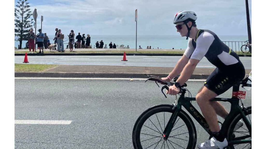 Author riding his bike during a 70.3 half ironman race